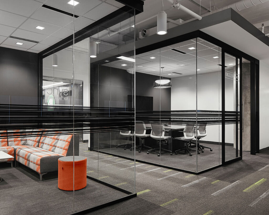 A meeting room with glass walls.