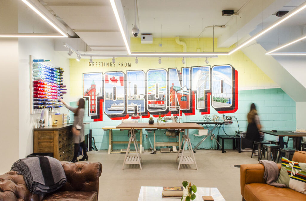 Retro mural depicting 'Toronto' with scenery in each of the words.