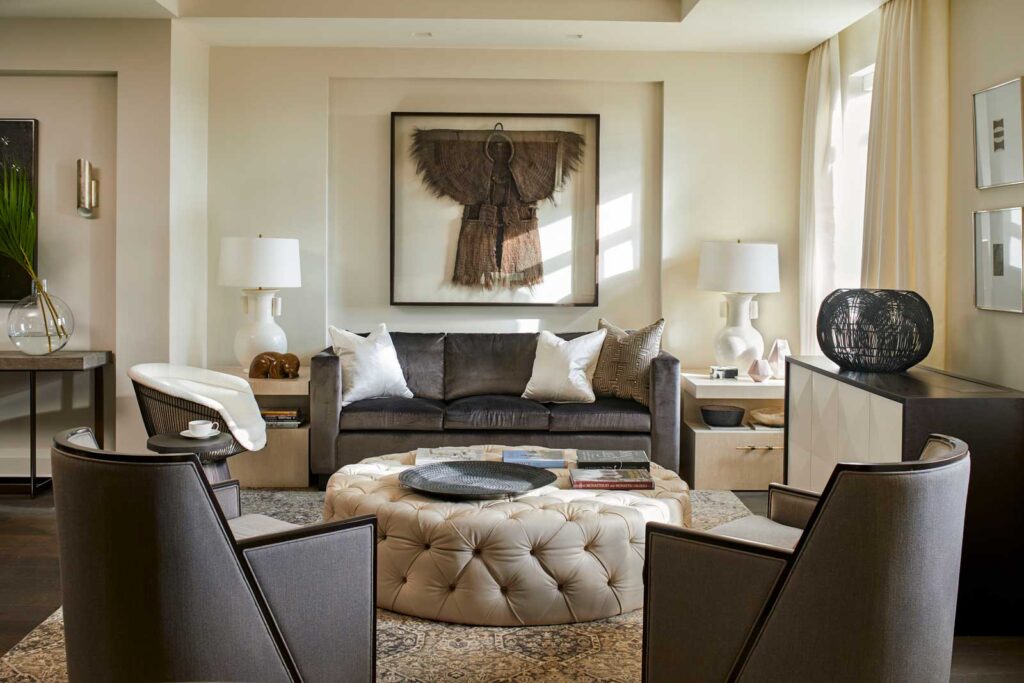 Luxe living room area in creams, browns and with cozy textured elements.