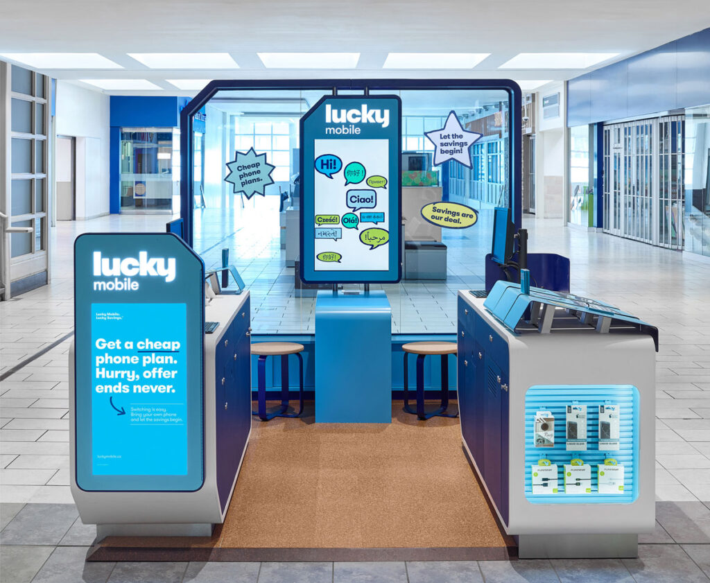 Lucky Mobile Kiosk with cork floor and two desk areas for sales.