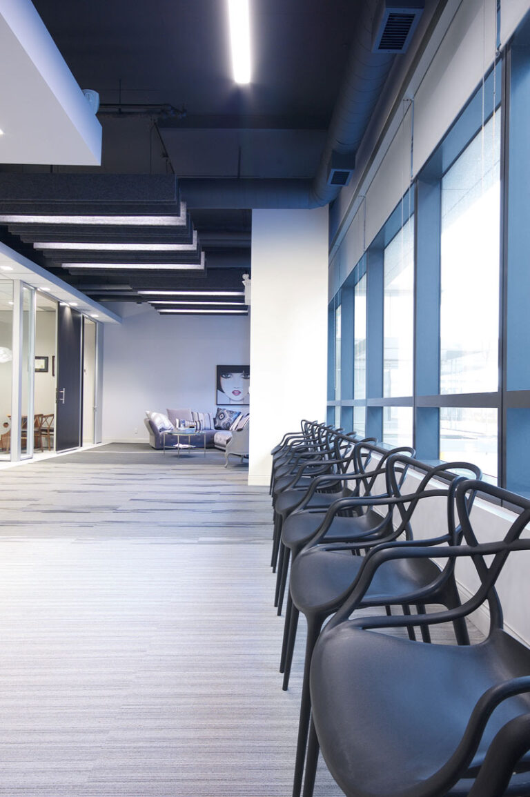 Along the windows, a line of black chairs can be moved into place for many classroom configurations.