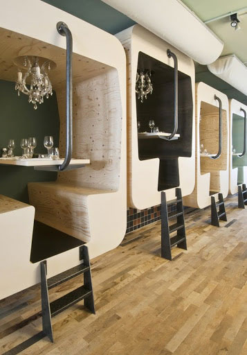 Dining booths with small laters and bench seating.