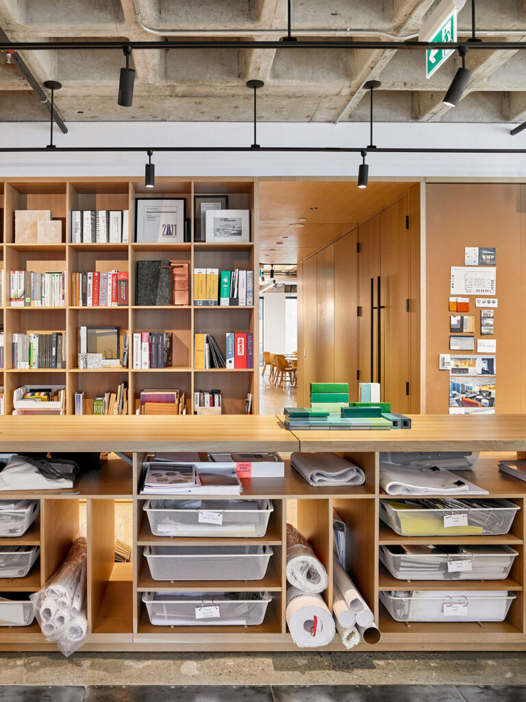 A long fixed table provides ample storage and a work top for this architectural firm.