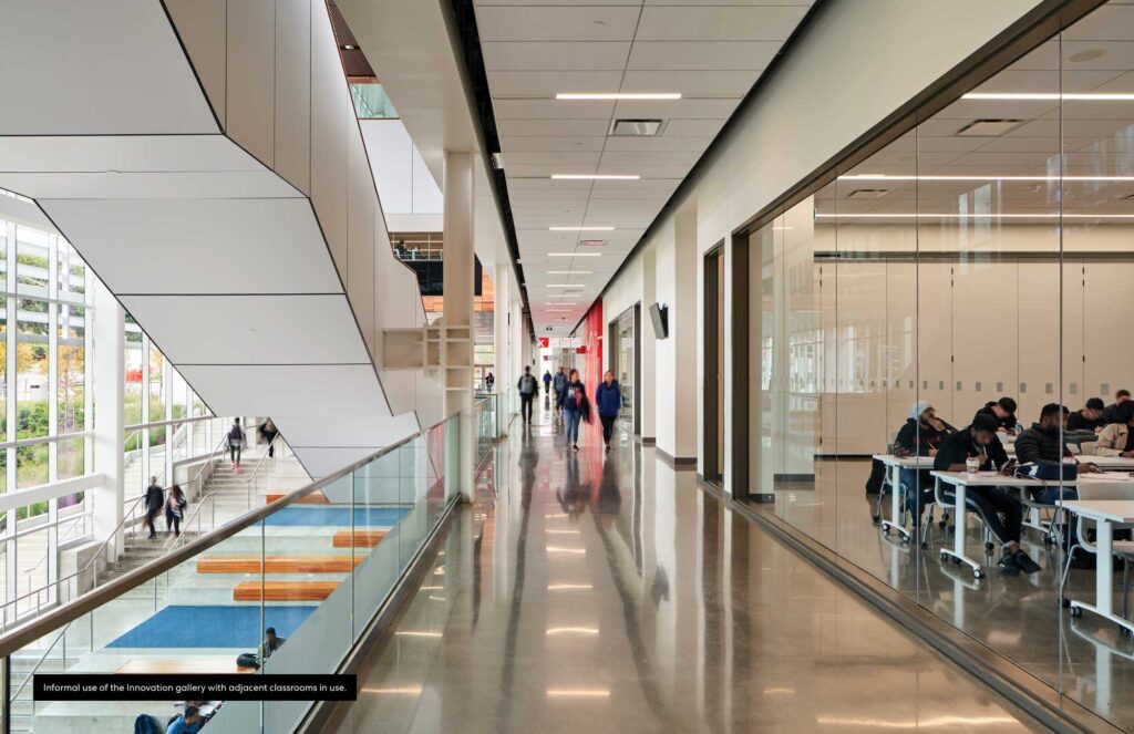 A long corridor next to the atrium lets light permeate all the way into the classrooms.