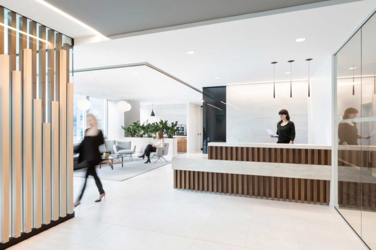 The offices of wealth management firm Richardson Wealth are a combination of crisp white walls and floors with understated wood elements.