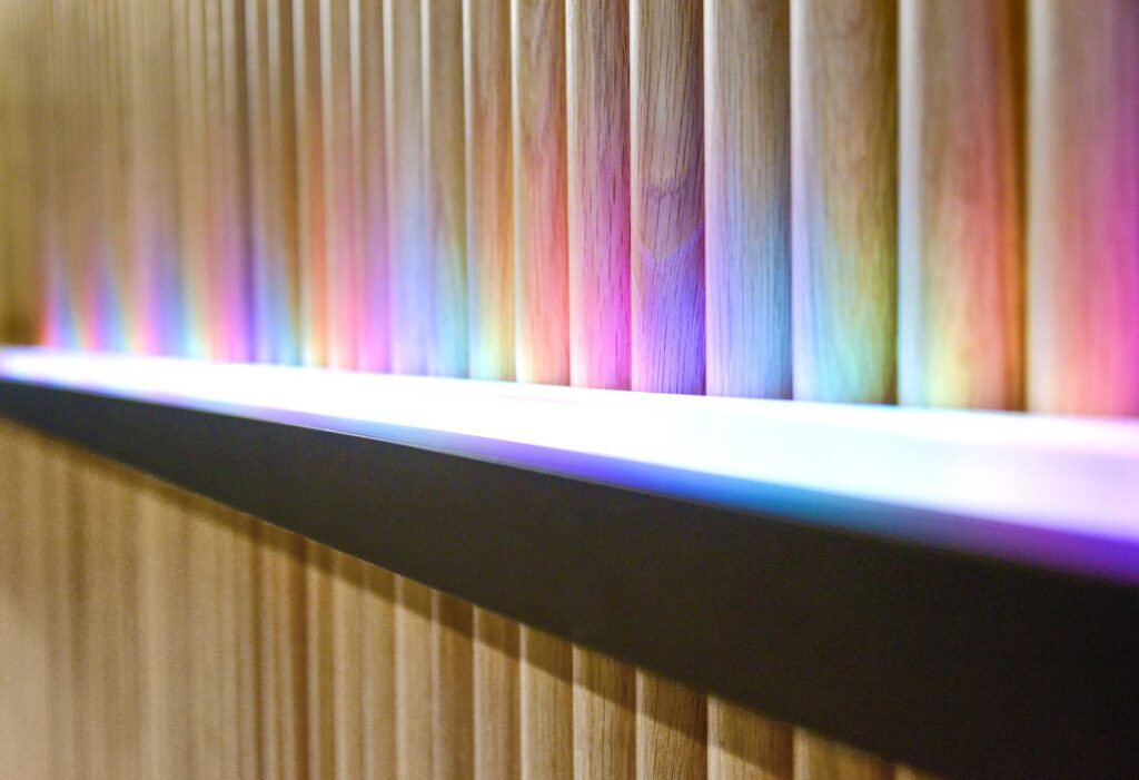Detail of a tambour wall installation which can be lit in various colour schemes for special events or observances.