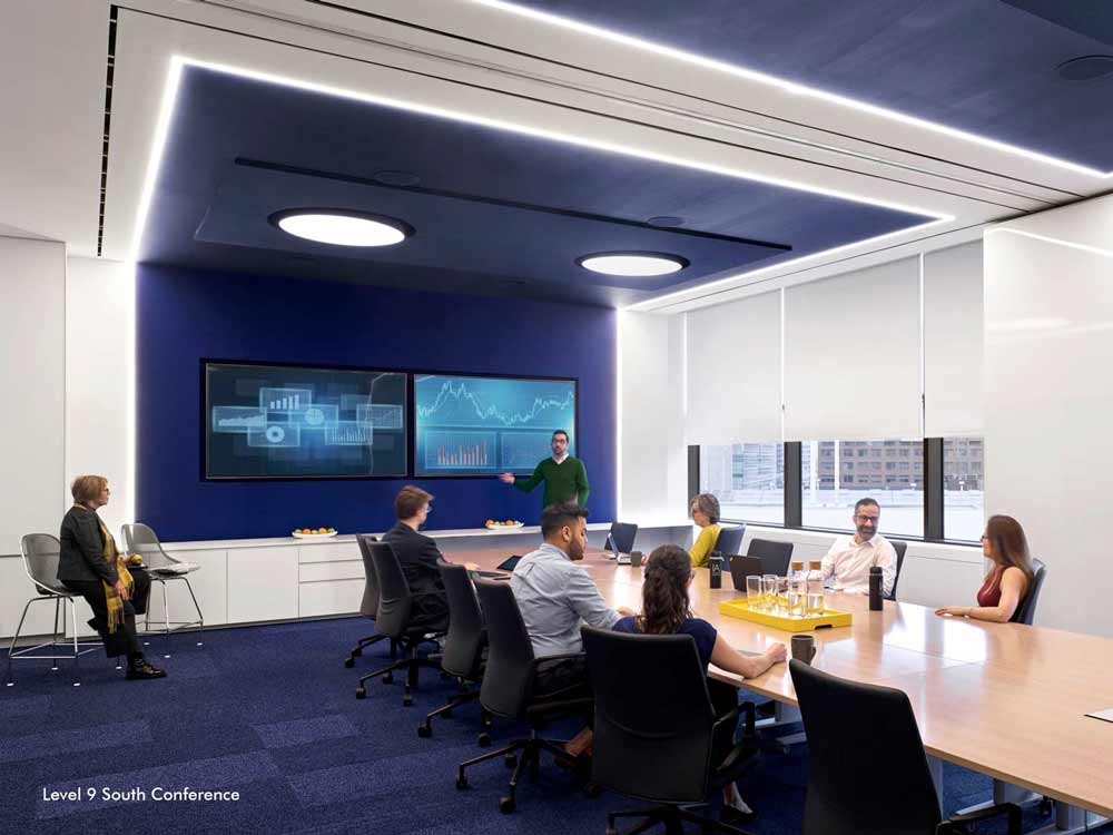 A predominantly blue large conference room, blue carpets and blue wall detail running up to the ceiling drawing the eye across the entire space.
