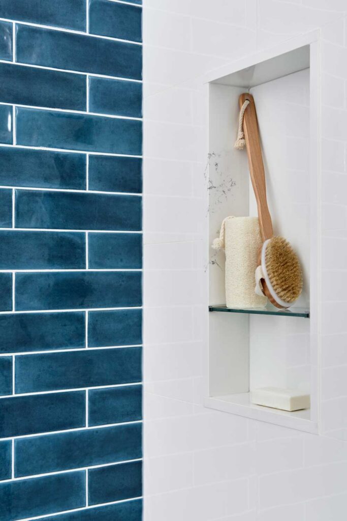 Detail of an in-shower built in shelf