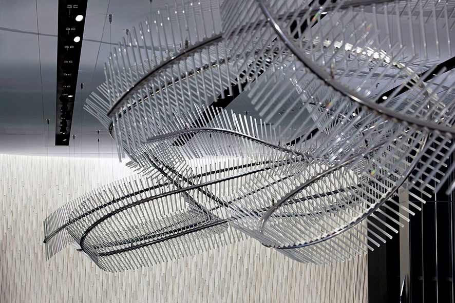Close up of Draco, a long crystal installation that dances across the ceiling