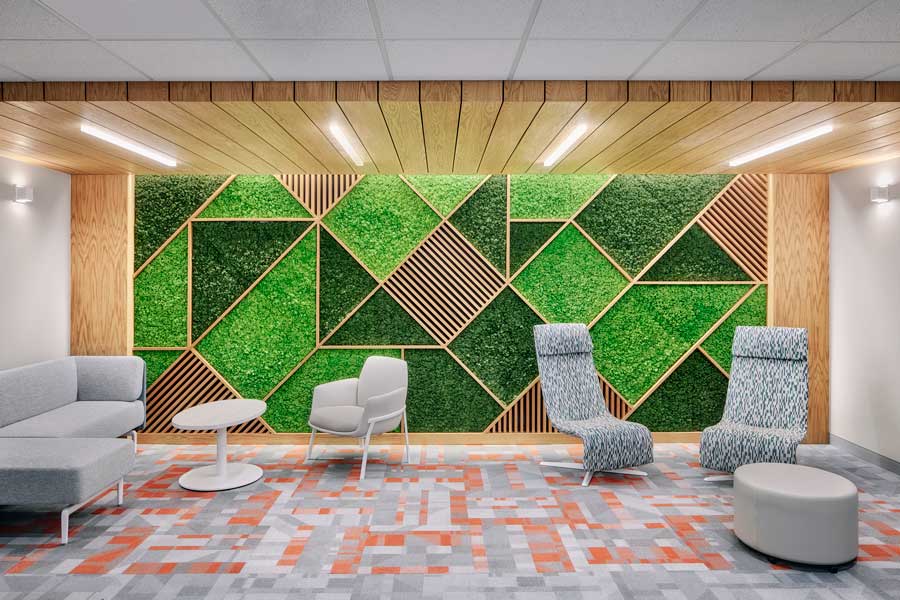 Lounge area featuring a large geometric detail biophilic design on the wall