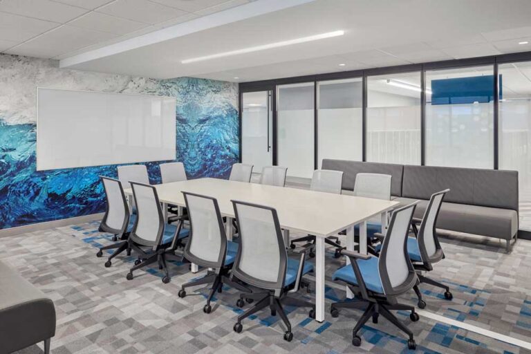 Large predominantly white conference room with a water inspired image mural feature wall