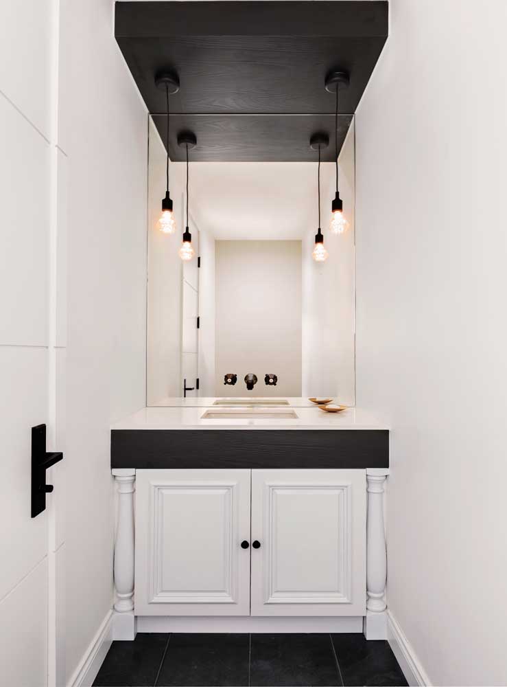 Blcak and white powder room vanity, in a mix of contemporary and traditional style