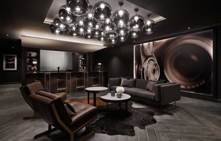 Luxurious bar and lounge area in Trafalgar Landing sales centre in dark luxe colour scheme and interior finishes