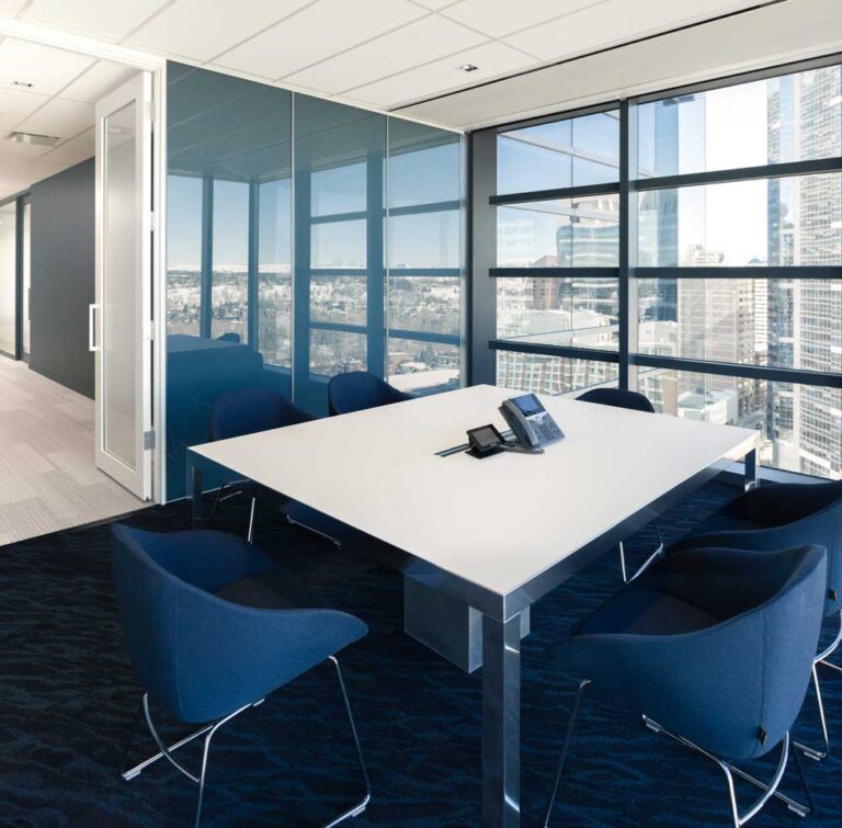 Meeting room in a prediminantly blue and white colour scheme, with stunning view of the city