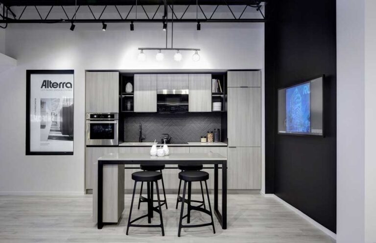 A contemporary kitchen vignette in the presentation centre, in grey and black colour scheme
