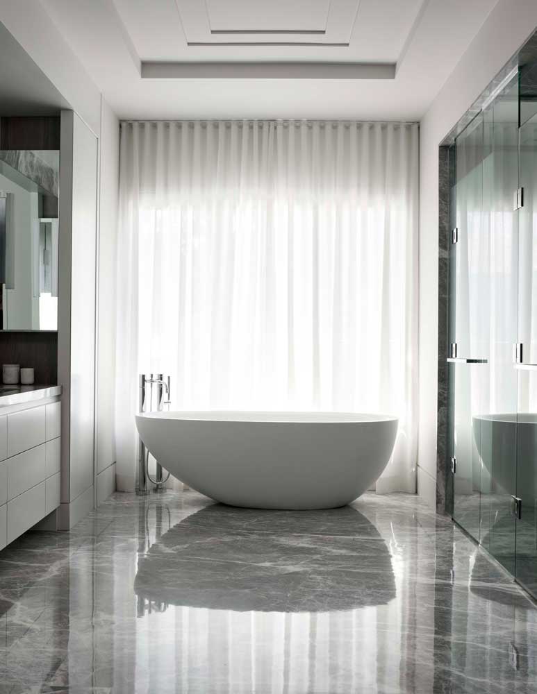 Free standing tub against the floor to ceiling window