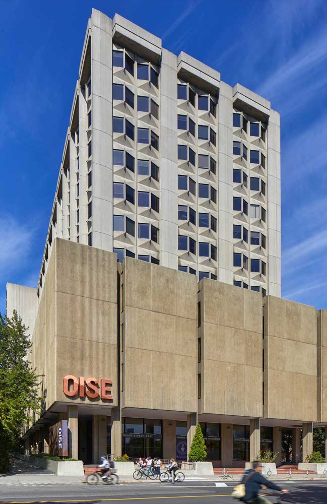 View of the OISE building from Bloor street and dimensional OISE letter sign on the front of the building