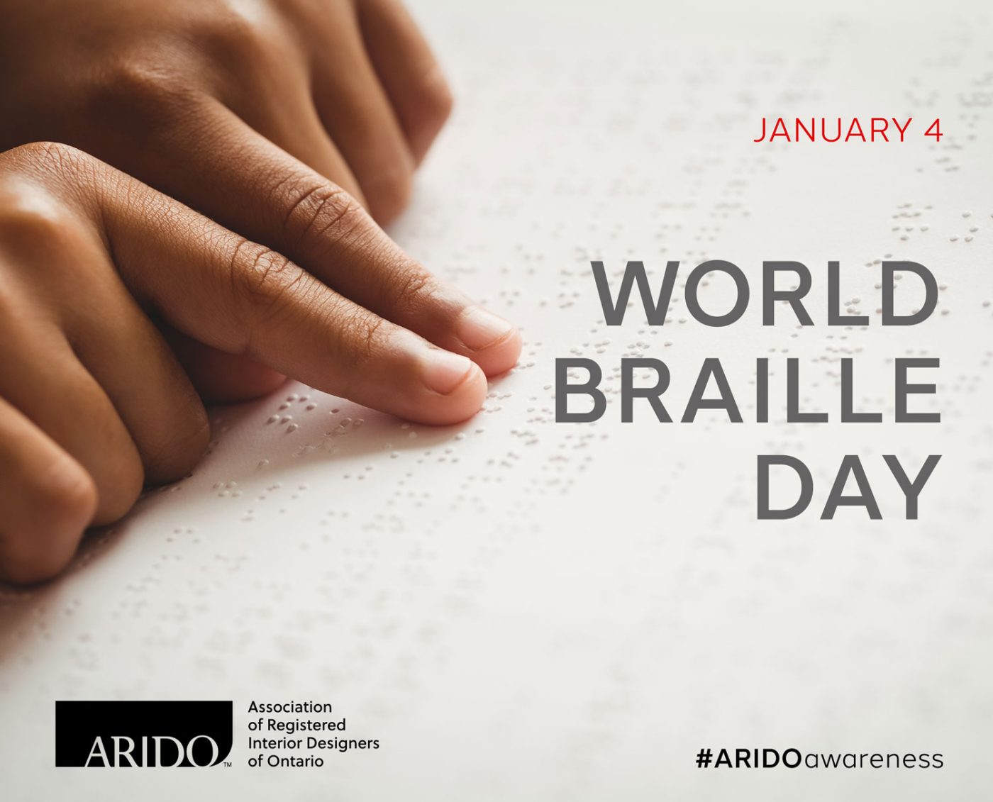 A child using their index fingers to read braille with the text World Braille Day.