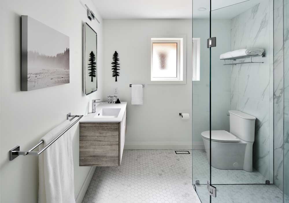 Main bathroom with curbless shower and modern touches throughout