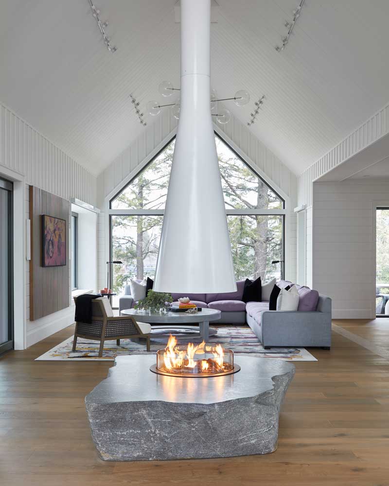 Beautiful living room  with a modern statement fire place in the centre