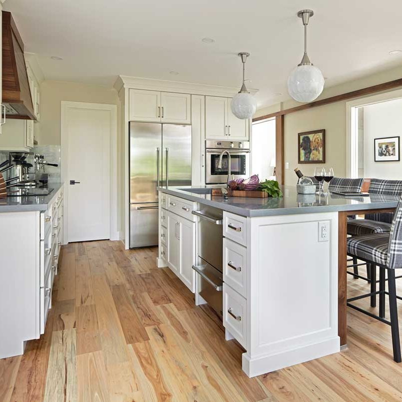 Open concept kitchen, featuring a large Island with seating, beautiful light woode flooring throughout