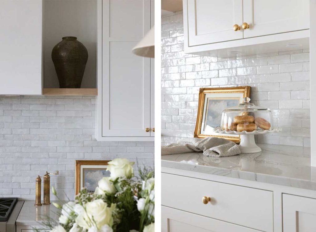 White Cle tile is carried from the far left side of the kitchen all the way across to the storage cabinets with unlacquered brass