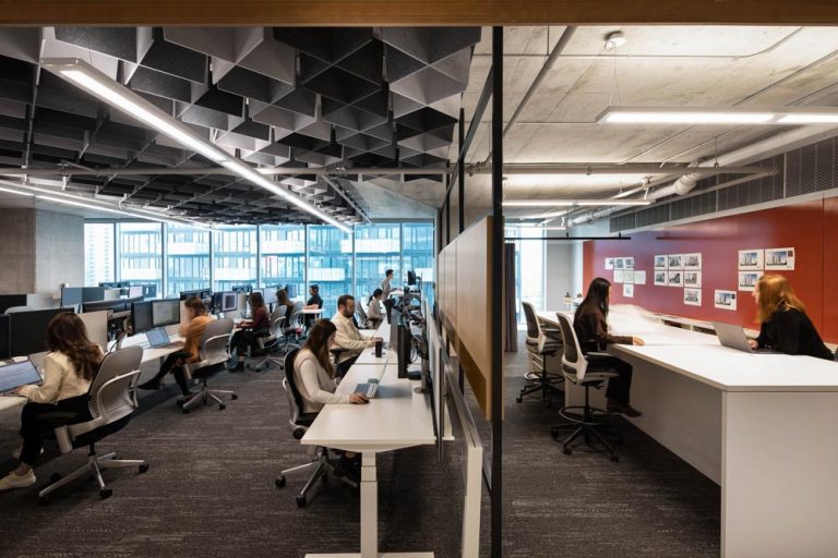 Work station area of the office space with an interesting detail on the ceiling