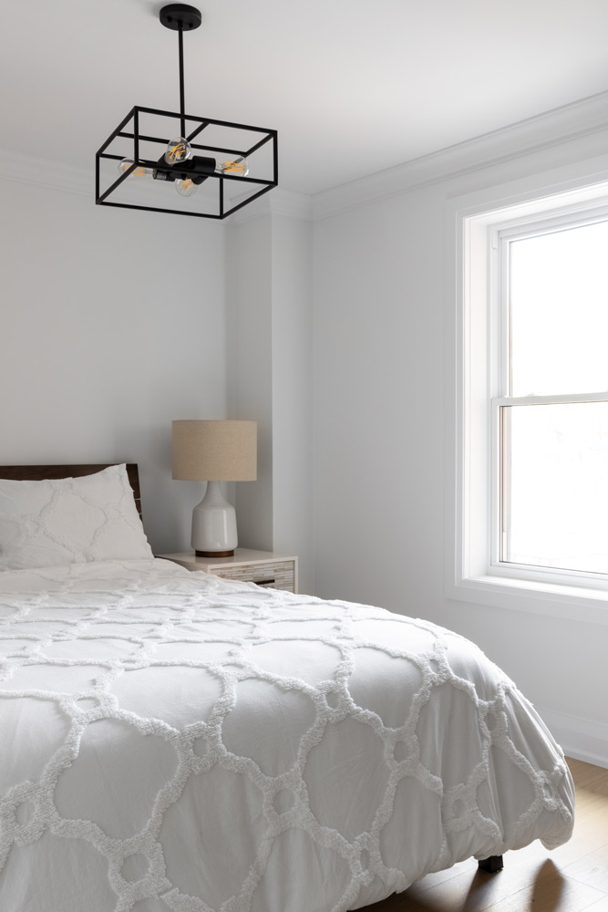 Clean and white main bedroom