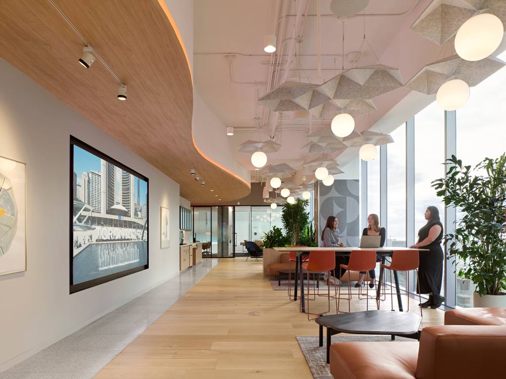 Common lounge area next to the floor to ceiling windows