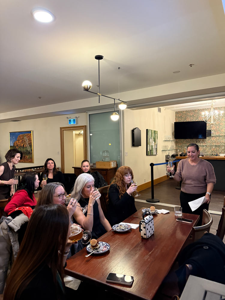 Member giving a speech and toasting with all other sitting 