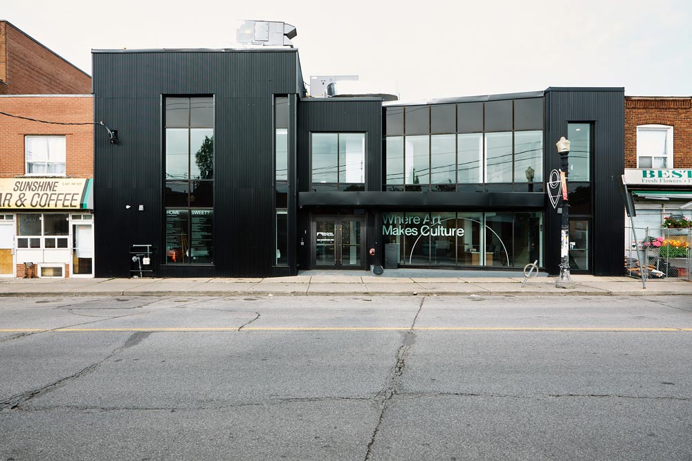 The black modern exterior of the Nia Centre featuring a lot of big windows