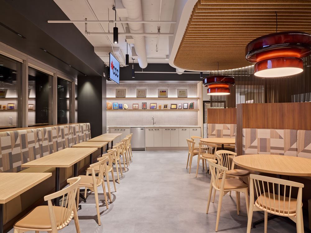 The staff lounge featuring custom banquettes, bar-height counters, and chainmail screens